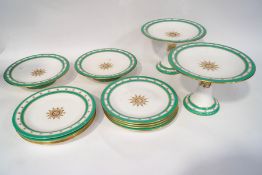 A Worcester dessert service, painted with roses within green bands, comprising eight plates,
