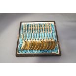 A cased set of twelve white metal apostle spoons, continental, with indistinct marks,