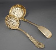 A Victorian silver sifting spoon, by Georg Adams, London 1862, fiddle pattern,