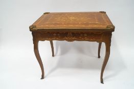 A 20th century Louis XVI style Kingwood games table,