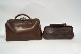 A small leather Gladstone bag, 39cm wide, and a leather bag, 33cm wide,