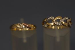 A 9 carat gold heart ring, the open motifs set with a single cut diamond,