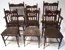 A set of six Edwardian mahogany chairs with unusual vertical line back and leather seats on turned