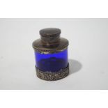 A silver mounted blue glass tea caddy and cover, Birmingham 1905, 19cm high.