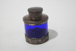 A silver mounted blue glass tea caddy and cover, Birmingham 1905, 19cm high.