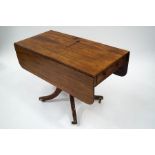 A George IV mahogany Pembroke table, having cutlery drawer to one end and opposing frieze drawer,