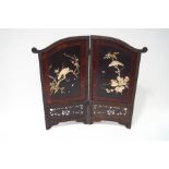 A 20th century Japanese two fold screen with applied carved bone decoration of birds,