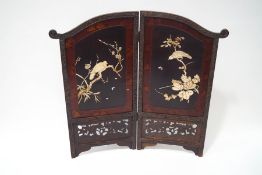 A 20th century Japanese two fold screen with applied carved bone decoration of birds,
