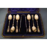 A cased set of six silver tea spoons and sugar tongs, by J.