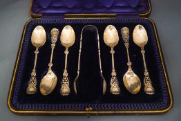 A cased set of six silver tea spoons and sugar tongs, by J.