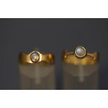 A 9 carat gold moonstone ring; and another similar; 5.