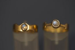 A 9 carat gold moonstone ring; and another similar; 5.