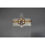 A seed pearl and sapphire flower head cluster ring, un-marked, finger size P, 1.