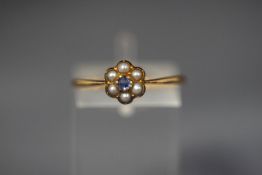 A seed pearl and sapphire flower head cluster ring, un-marked, finger size P, 1.