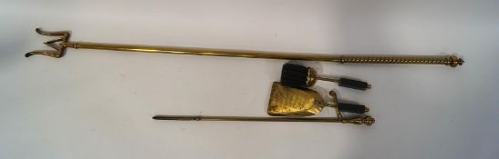 A 19th century brass log turner, with rope twist handle,