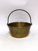 A brass preserve pan, with handle,