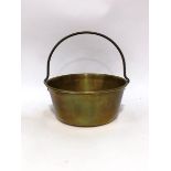 A brass preserve pan, with handle,