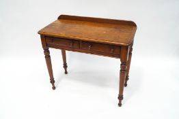 A Victorian mahogany sidetable with two drawers, upon turned legs,