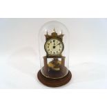 An early 20th century brass torsion clock, the dial signed M.H.
