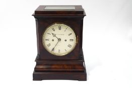 A 19th century mahogany cased library clock, the eight day double fusee movement striking on a bell,