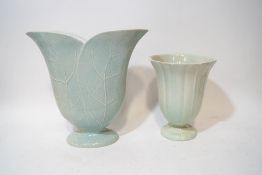 An early 20th century tin glazed earthenware vase, in the form of two leaves,