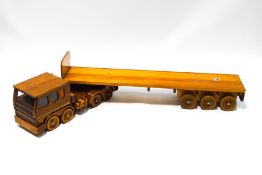 A modern pine child's wooden toy truck, 78cm long, and trailer,