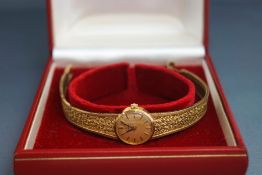 A 9ct gold ladies Omega mechanical bracelet watch, 21 g gross excluding the movement,