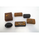 A wooden cigarette box, the lid inlaid with a dog's head, and five 19th century snuff boxes,