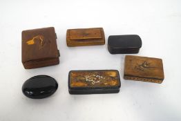 A wooden cigarette box, the lid inlaid with a dog's head, and five 19th century snuff boxes,