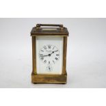 A brass Charles Frodsham carriage clock, the movement striking on a gong,