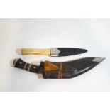 A Scottish sgian dhu with bone handle and silver mounted sheath,