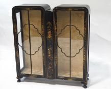 An early 20th century double fronted display cabinet, with lacquered Japanese style decoration,