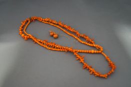 Two coral necklaces and a pair of earrings