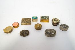 A collection of nine pill boxes,