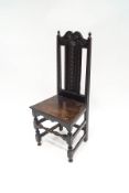 A Victorian carved oak side chair in the 17th century style,