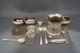 A set of three late Victorian silver salts; a silver bottle stand,