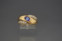 A tanzanite and diamond ring, stamped '14K', finger size T, 8.