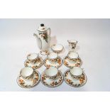 A Royal Doulton tea service of small proportions, decorated with a citrus fruit pattern,