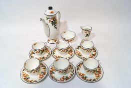 A Royal Doulton tea service of small proportions, decorated with a citrus fruit pattern,