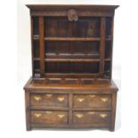 An 18th century oak chest of four drawers with coffer panel top, 77cm high x 151cm wide x 59cm deep,