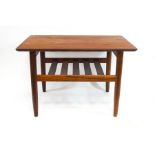 A G-plan teak coffee table with magazine shelf,