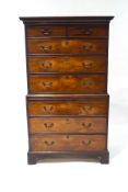 A George III mahogany chest on chest, the upper half with two short over three long drawers,