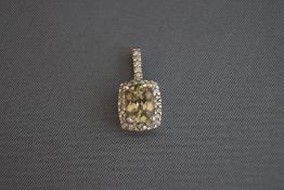An 18ct white gold green zircon and diamond set pendant, 2.