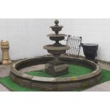 A circular Victorian style stone pond surround, approximately 265cm diameter,