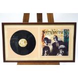 A signed travelling Wilburies album by Bob Dylan, George Harrison,