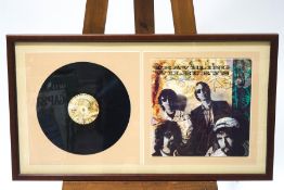 A signed travelling Wilburies album by Bob Dylan, George Harrison,