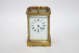 A brass quarter repeater carriage clock with winding key,