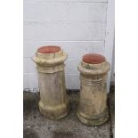 Two re-constituted stone chimney pots, one of octagonal form,