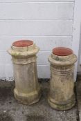 Two re-constituted stone chimney pots, one of octagonal form,