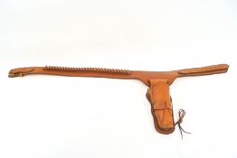 A Western hand made brown leather rig with tooled detailing